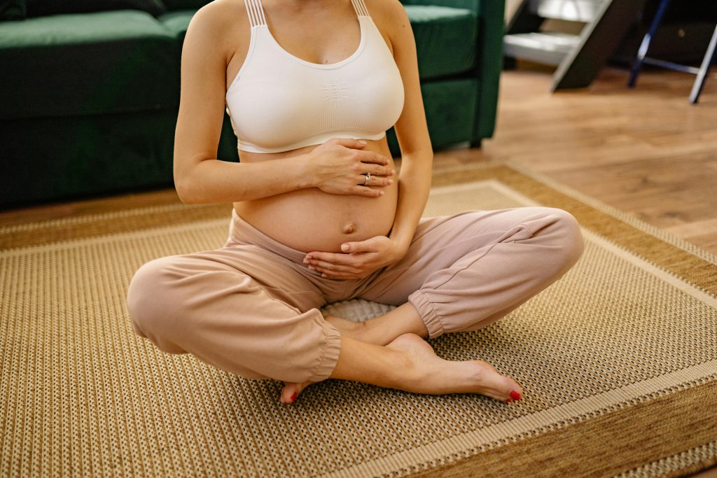 A woman sitting peacefully with her eyes closed, reflecting