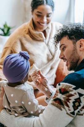 A parent talking to their baby