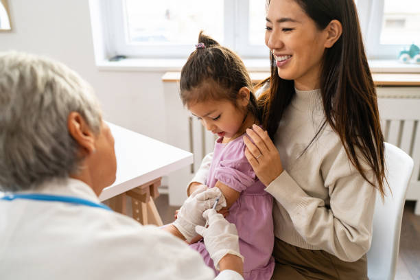 A healthcare professional preparing a vaccination